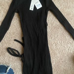 Long black duress long sleeve slit in the back .